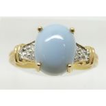 A 9ct gold ring set with a opal cut blue fire opal cabochon and diamonds, 2.9g, size N