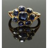Victorian/ Edwardian yellow metal ring set with a cluster of sapphires, size K/L, 3.30g
