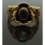 Victorian 18ct gold mourning ring set with a central glass compartment surrounded by black enamel