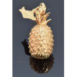 A yellow metal charm/ pendant in the form of a pineapple and Hawaii island, 7.4g