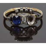 Georgian ring set with a foiled sapphire and paste with white enamel decoration and diamonds in a