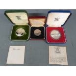 Two Royal Mint commemorative silver cased crowns together with a Common Market 50p