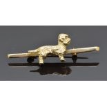 A 9ct gold bar brooch in the form of a Dandie Dinmont dog, 9.3g