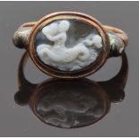 Georgian / Victorian yellow metal ring set with a cameo depicting a merman playing a conch shell,