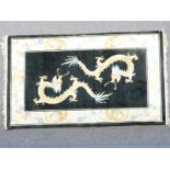 Chinese style rug with two golden dragons in central field surrounded by cream ground floral /