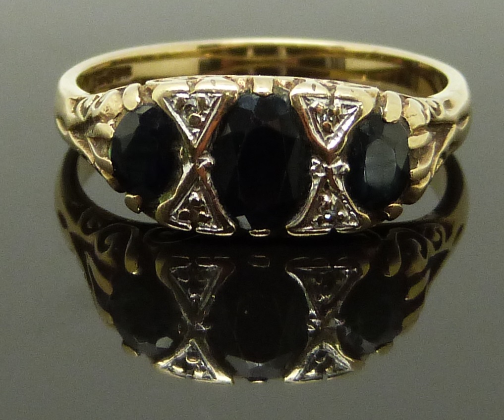 A 9ct gold ring set with sapphires and diamonds, size S/T, 4.43g