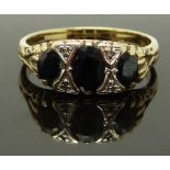 A 9ct gold ring set with sapphires and diamonds, size S/T, 4.43g