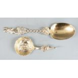 Two Continental gilt white metal spoons, one with embossed decoration to bowl, no visible marks