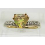 A 9ct gold ring set with a trilliant cut opal and diamonds, 1.7g, size M