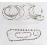 Six silver bangles, two silver rings and a matching silver necklace and bracelet