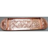 Arts and Crafts copper tray with hammered decoration of mythical creatures, length 77cm
