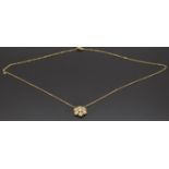 A 14ct gold necklace in the form of a snowflake set with cubic zirconia, 2.3g