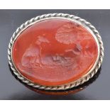 Victorian silver brooch set with a carved carnelian agate panel depicting a dog and a hare, 2.5 x