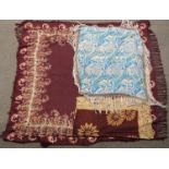 A 19th/20thC burgundy shawl with floral decoration and fringe border and two printed silk shawls,