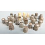 Sixteen various hallmarked silver and white metal thimbles and further thimbles including a mother