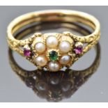 Victorian ring set with an emerald, split pearls and rubies with an engraved band, size N