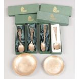 Four cased hallmarked silver teaspoons and two feature hallmarked silver pin dishes, weight 187g