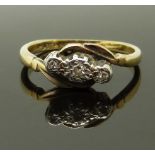A 9ct gold ring set with three diamonds in a platinum setting, size M/N, 2.41g