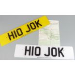 Car registration number H10 JOK on retention, with a pair of number plates
