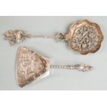 Dutch white metal sifter spoon with 1928 Dutch silver marks,together with a caddy spoon with 1924