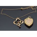 Victorian 9ct gold shield shaped locket with engraved swallow and floral decoration and a 9ct gold