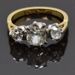 An 18ct gold ring set with three old cut diamonds measuring approximately 0.83, 0.2 & 0.2cts, size