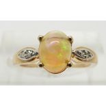 A 9ct gold ring set with an opal cabochon and diamonds, 1.8g, size J