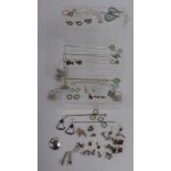 A collection of silver jewellery including earrings, a quantity of new silver necklaces and rings