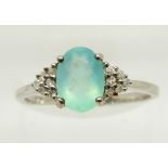 A 9ct white gold ring set with an oval cut Paraiba opal and diamonds, 1.9g, size N