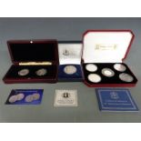 Three Pobjoy Mint cased silver coin sets comprising a proof 25th Anniversary of Liberation, a