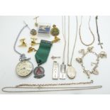 A collection of silver jewellery including charm bracelet, necklace, bracelet, locket, two ingots,