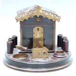 19th/early 20thC cigar box in the form of a house with cigar cutter to front, on circular base, 15cm
