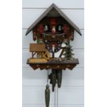 Swiss made 20thC three train cuckoo clock with musical movement on the hour and half hour and