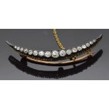 Victorian crescent brooch set with graduated old cut diamonds, 4.8cm long