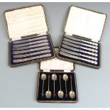 Cased set of hallmarked silver coffee bean spoons and two cased sets of hallmarked silver handled