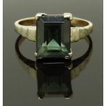 A 9ct gold ring set with an emerald cut topaz, size N/O, 3.47g