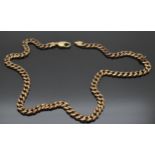 A large 9ct gold curb link necklace, 67.1g