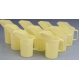 Nine Duckhams oil jugs, height 21cm