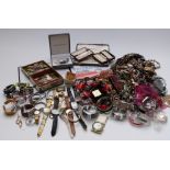 A large collection of costume jewellery, coins and watches including Swatch, beads, etc