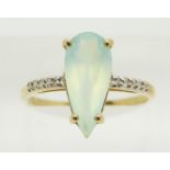 An 18ct gold ring set with a pear cut Paraiba opal and diamonds, 2.4g, size N