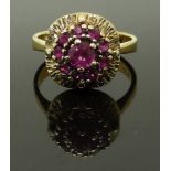 A yellow metal ring set with a cluster of pink paste, size M, 4.48g