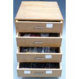 Four drawer clock repairer's cabinet containing parts and some tools, H32 x W26 x D30cm