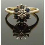 A 9ct gold ring set with sapphires and a diamond, size L, 2.17g