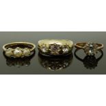 A 9ct gold ring (2.5g), a silver gilt ring set with paste and another ring, size J, N & R