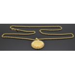 A 1958 gold full sovereign in yellow metal mount (18.1g) on 18ct gold rope twist chain (25g)