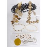 A collection of beaded necklaces including pearls