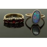 A 9ct gold ring set with garnets and another 9ct gold ring, size N & Q, 5.10g