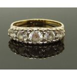 A 14ct gold ring set with cubic zirconia, the setting reading 'I love you', size N, 2.79g