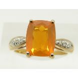 A 9ct gold ring set with a cushion cut fire opal and diamonds, 3.2g, size N