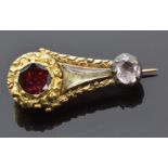 Victorian brooch in the form of Halley's comet set with a foiled garnet, foiled quartz and a glass